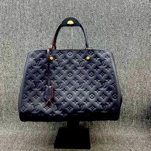 Brand new Louis Vuitton Montaigne GM Navy Monogram leather handbag